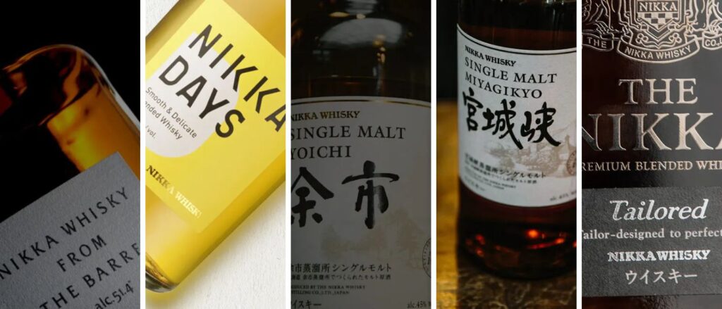 Cinq bouteilles de whisky japonais Nikka vues en gros plan, représentant différentes cuvées emblématiques de la marque. Le Club des Connaisseurs